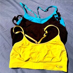 Yellow, black and aqua blue Sports Bras size small .  Champion brand bundle